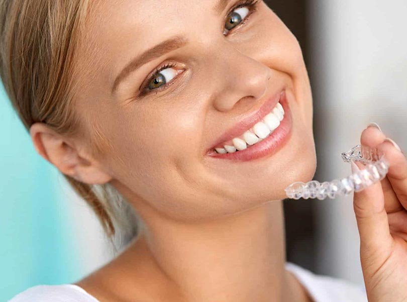 woman happy for her invisalign braces