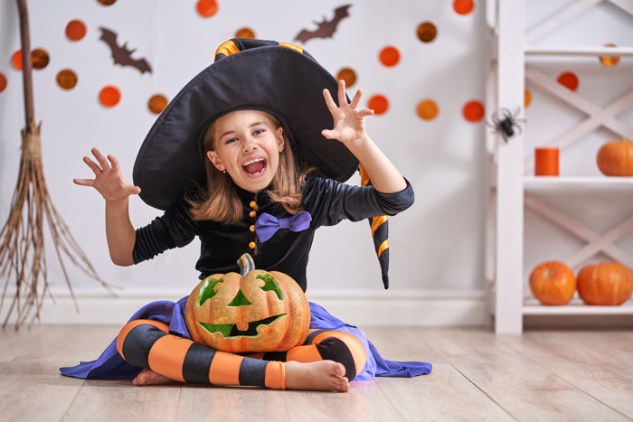 girl-in-witch-costume-happy-halloween