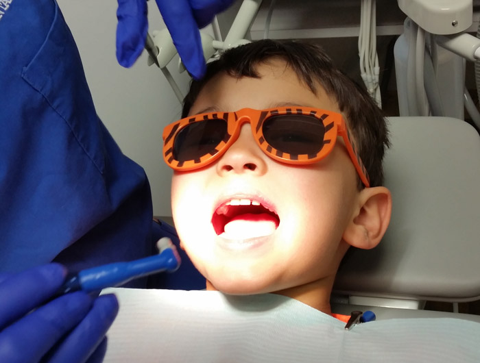 Sedation Dentist working on kid
